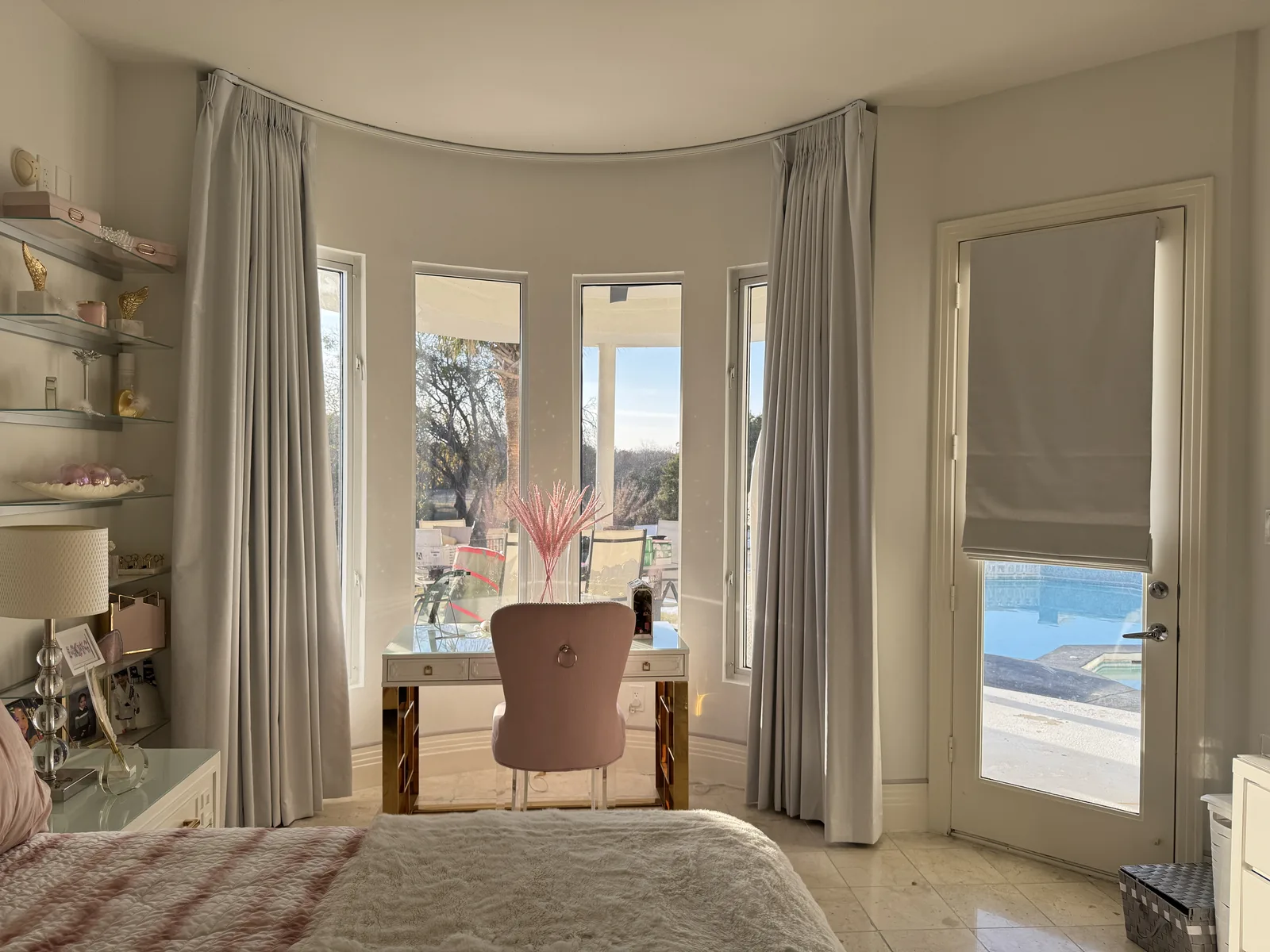 Floor-length drapery on a bedroom bay window