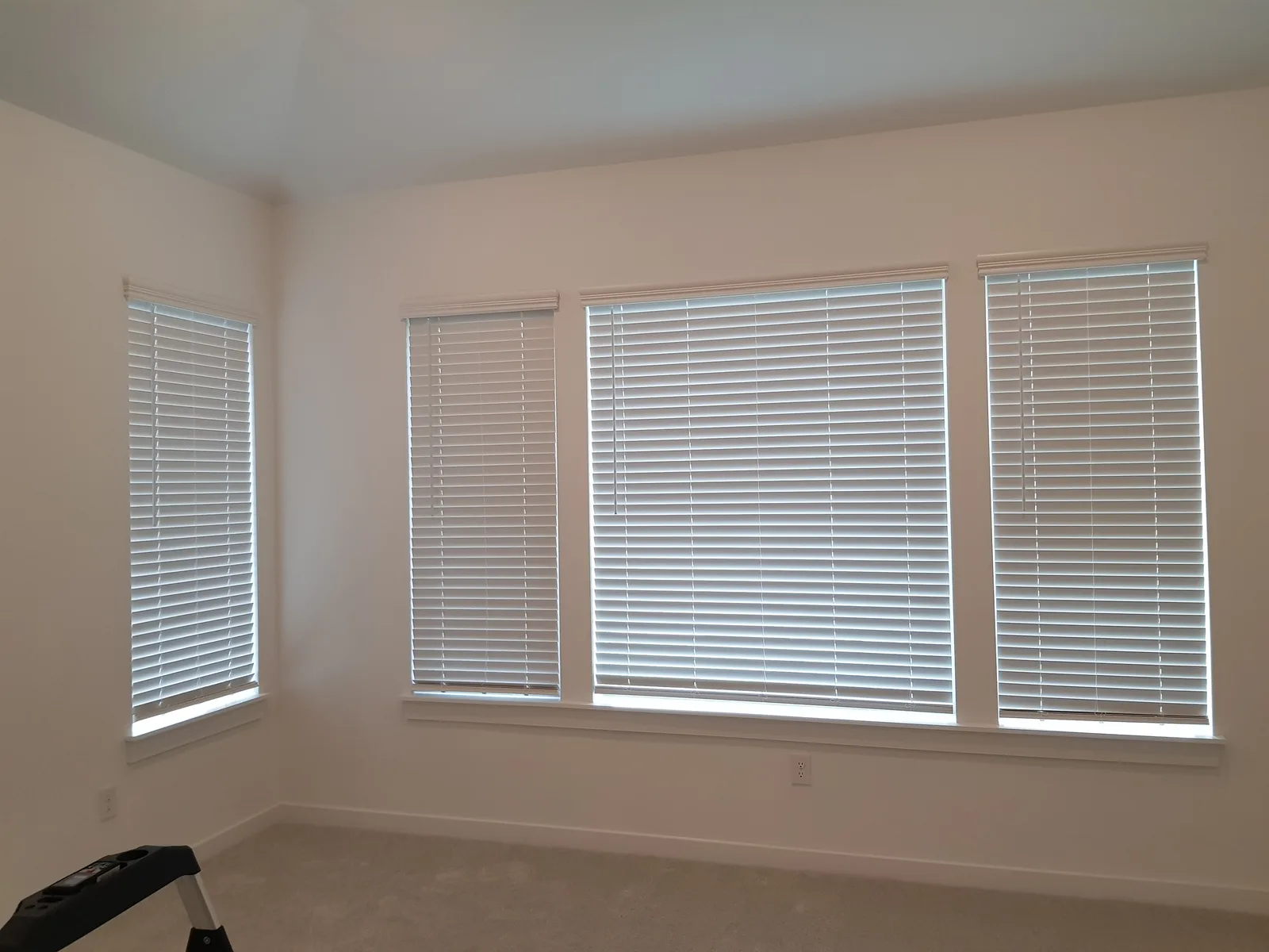 Two-inch faux wood blinds on four bedroom windows