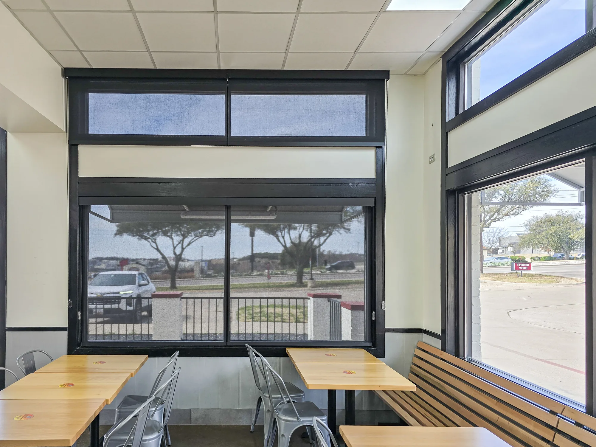 Sunscreen on the windows of a restaurant dining area